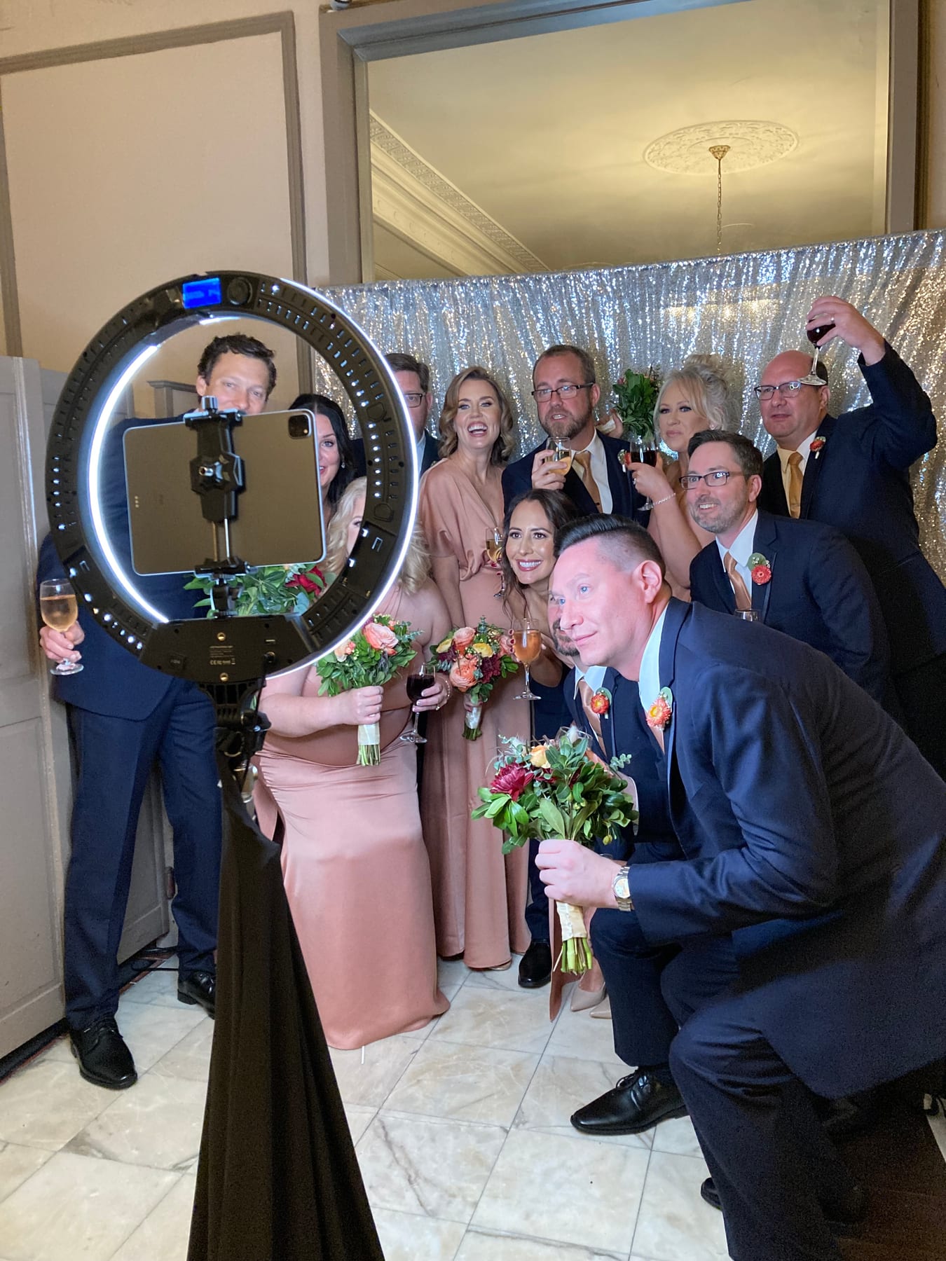 Wedding guests enjoying the photo booth