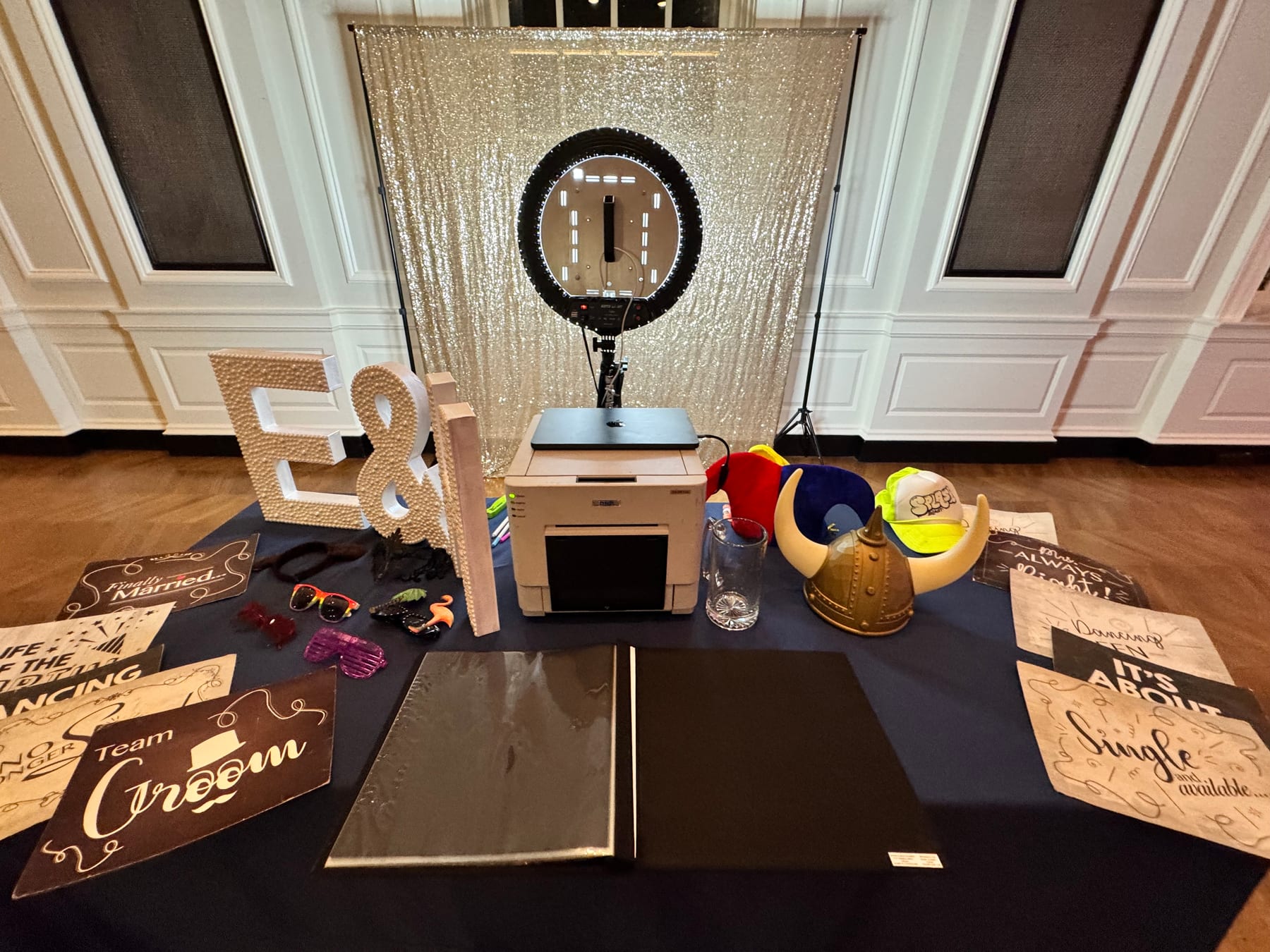 Photo booth setup with printer and props